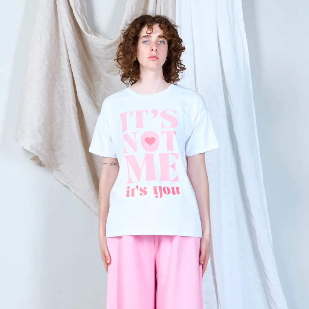 Bold statement graphic "IT'S NOT ME" t-shirt wholesale