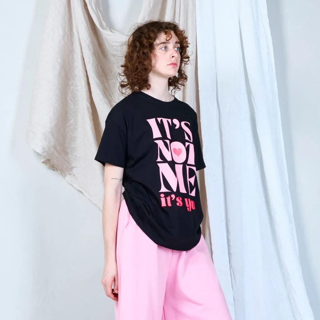 Bold statement graphic "IT'S NOT ME" t-shirt wholesale