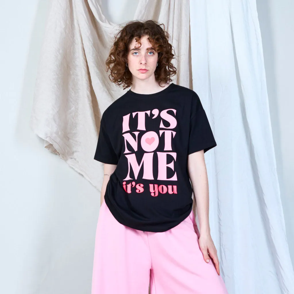 Bold statement graphic "IT'S NOT ME" t-shirt wholesale